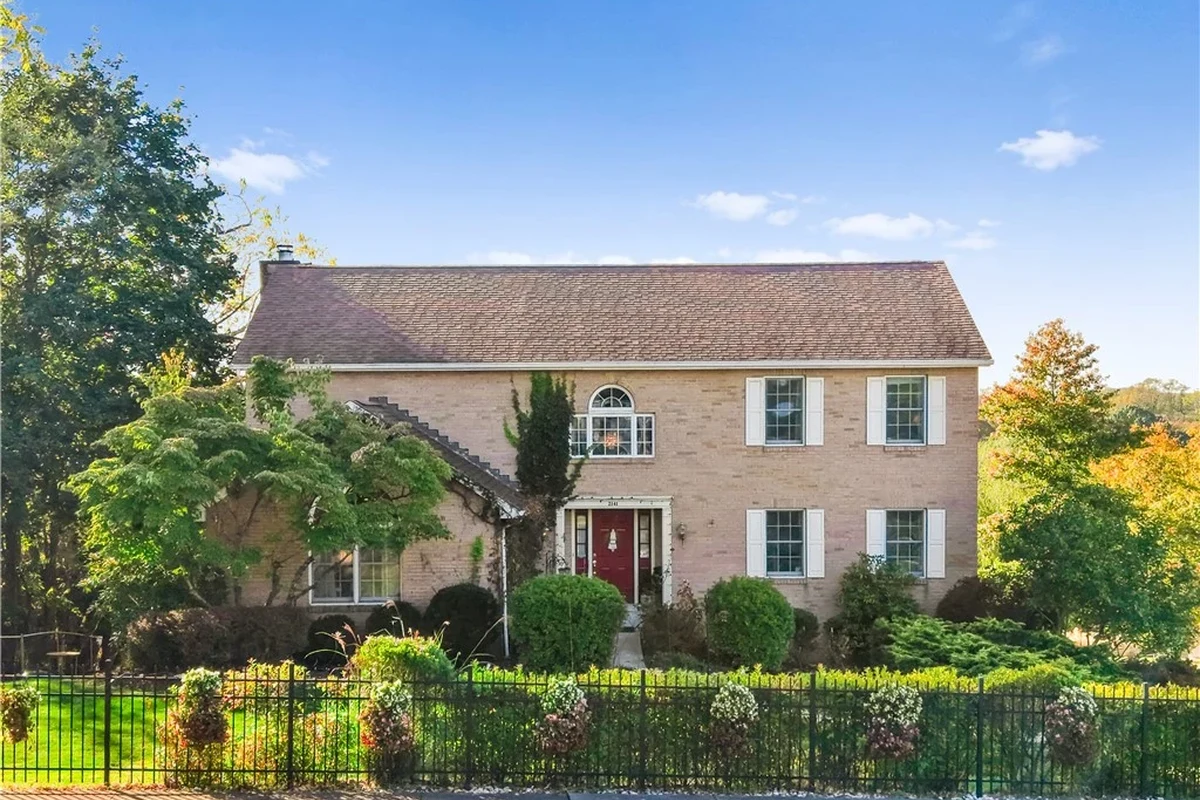 Suburban Monroeville PA home exterior with smart home features and front yard