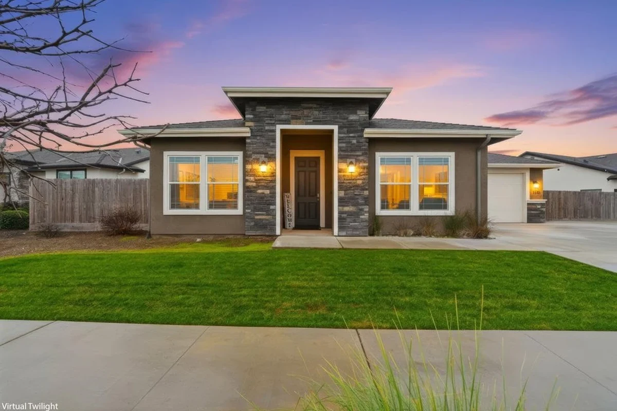 Modern single-family home exterior in Porterville, California with yard and driveway