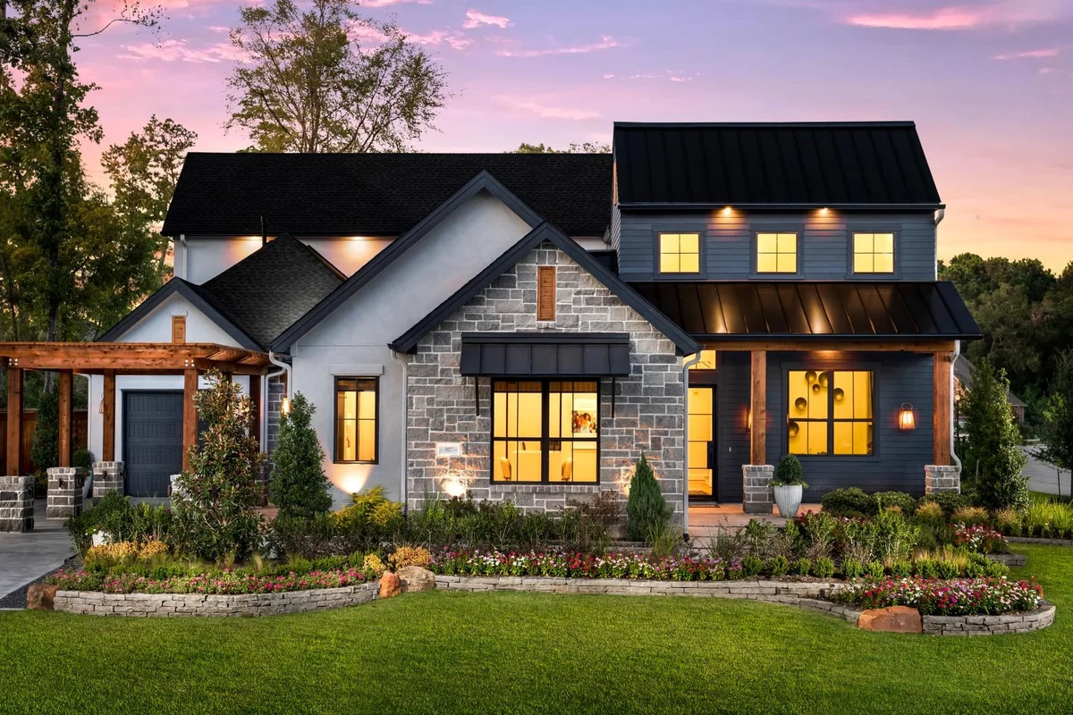 Modern new construction home exterior with smart home features and clean landscaping