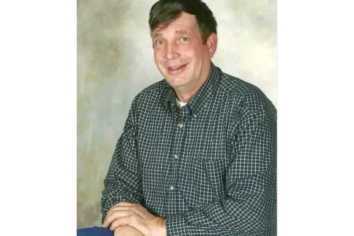 Funeral home obituary listing on a phone for Rainelle, West Virginia service details